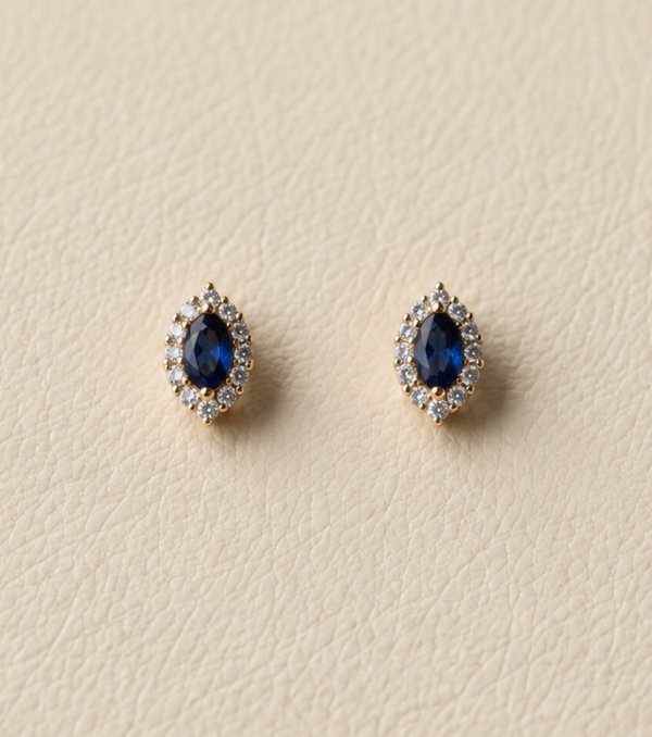 Aretes con piedra imitación zafiro y baño de oro de 18K