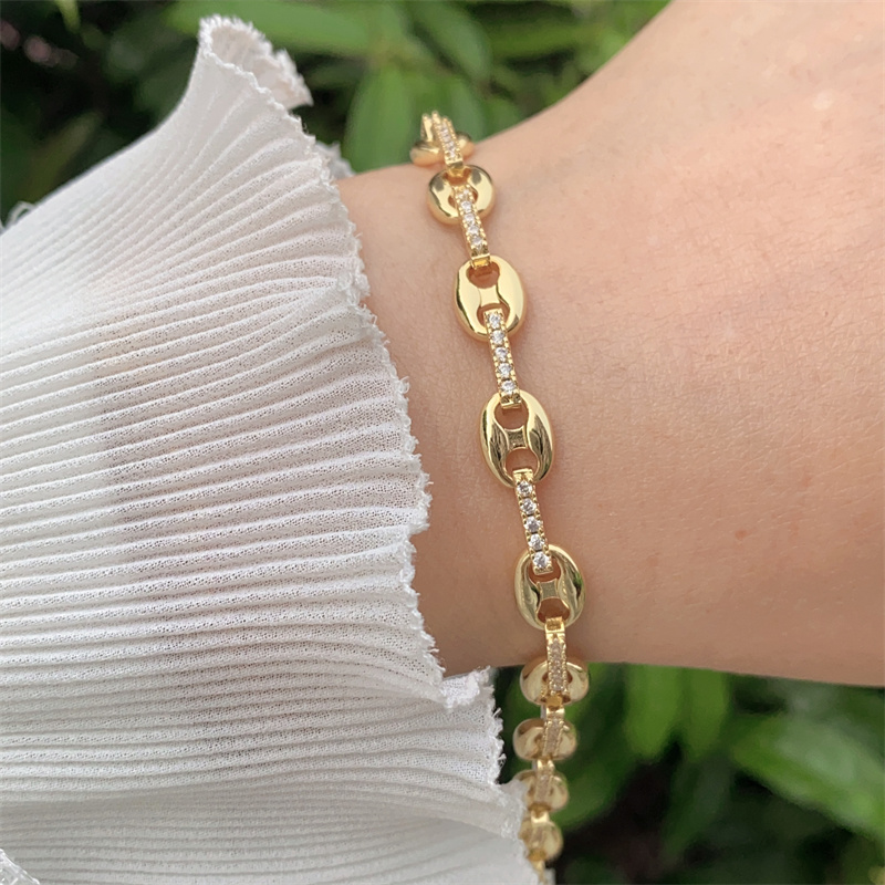 Pulsera con candado doble, baño de oro de 18k y circonitas